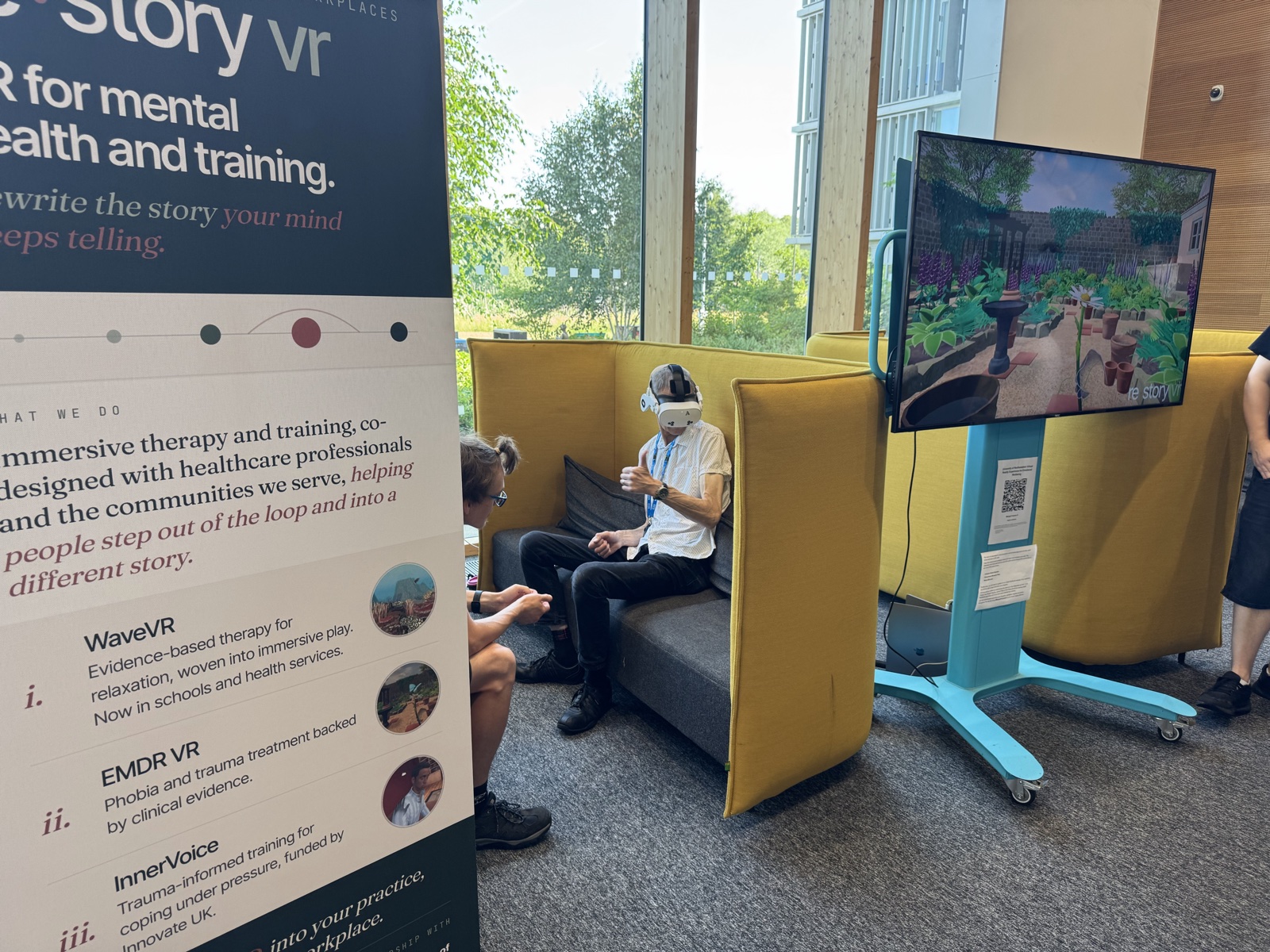 Attendee wearing the WaveVR headset at the stand